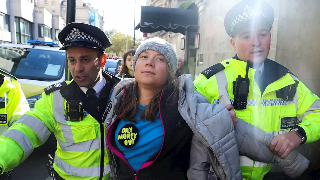 Greta Thunberg is ARRESTED at London protest: Activist is hauled into police van after urging...