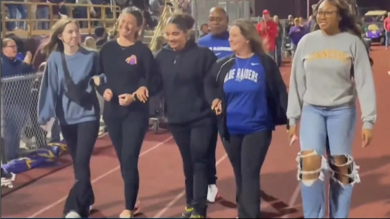 Teen who lost both legs walks with new prosthetics at high school football game