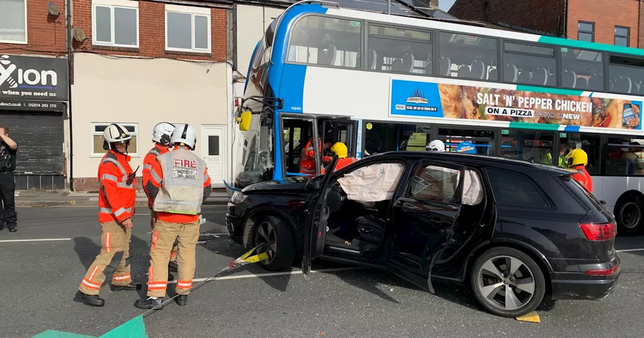 BREAKING: Road closed after crash between Audi and double decker bus