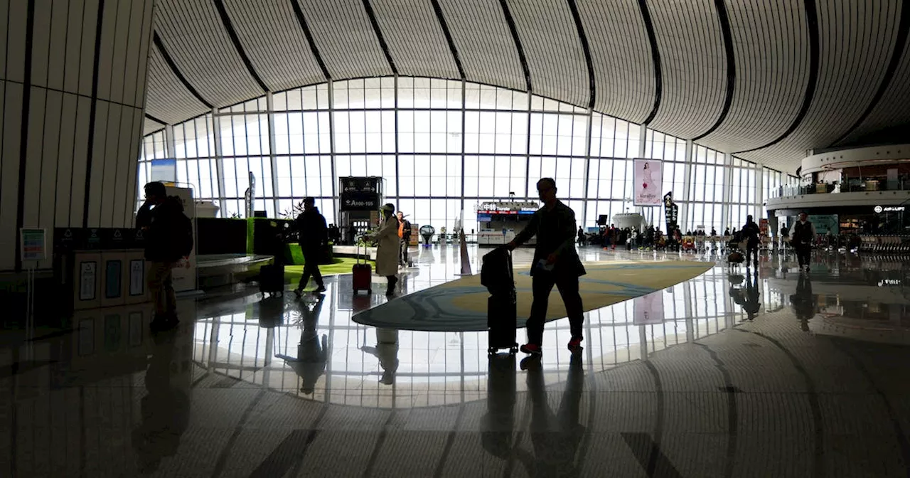 China tightens curbs on foreign travel by bankers, state workers