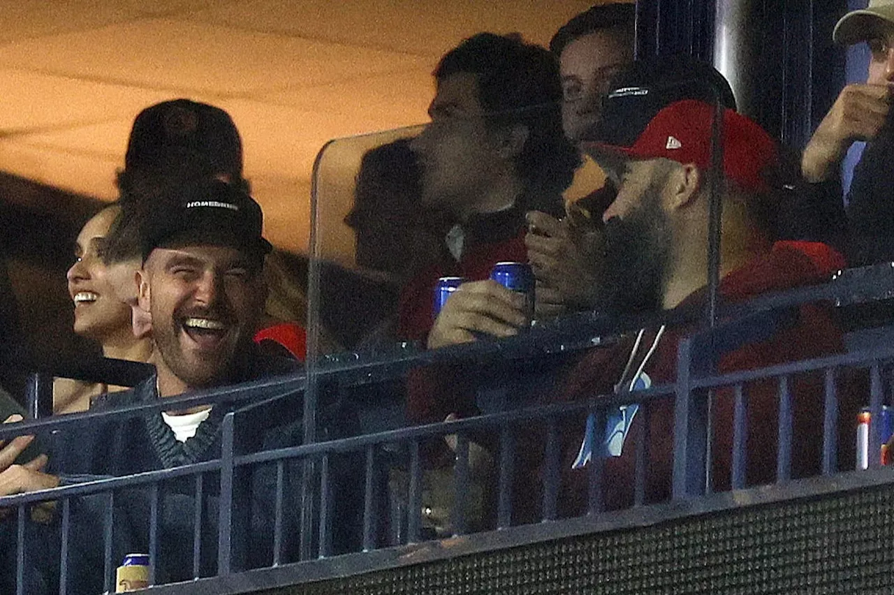 Travis and Jason Kelce put NFL rivalry aside and enjoy beers together while watching MLB...