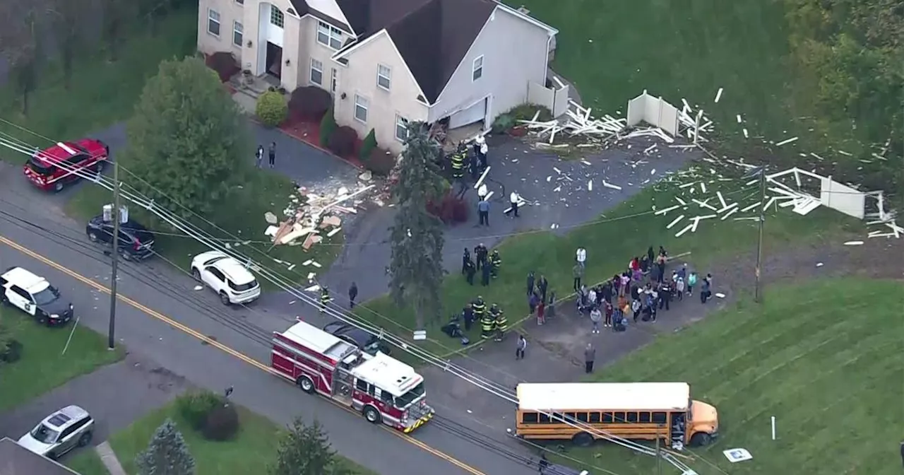 School bus with students on board slams into home in Edison, New Jersey