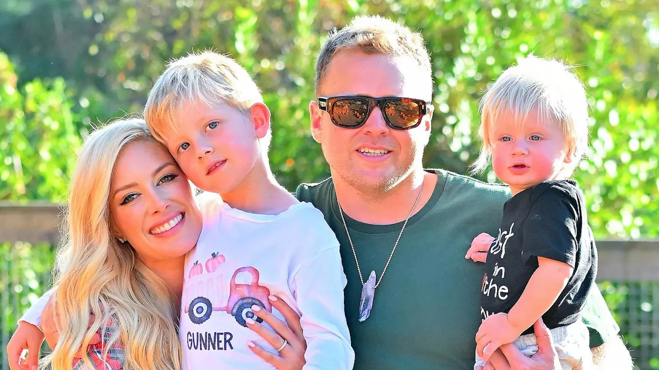 Heidi Montag and Spencer Pratt of The Hills share a kiss at a pumpkin patch with their sons Gunner,...