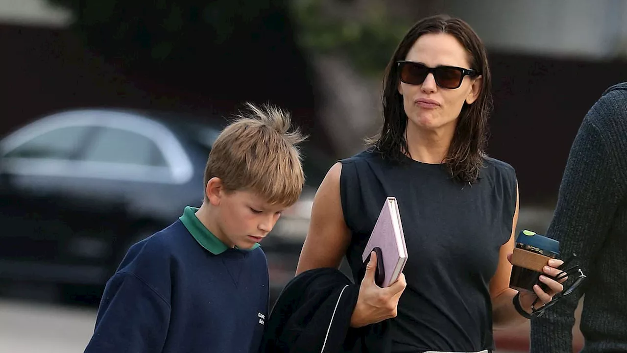 Jennifer Garner shows off her toned arms in sleeveless black T-shirt while grabbing coffee with her...