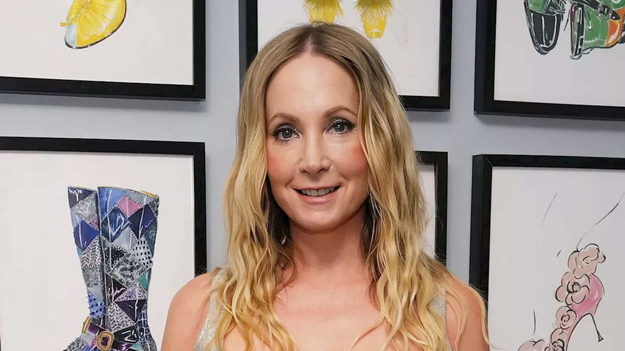 Downton Abbey's Joanne Froggatt stands out in plunging metallic bodice and flared trousers