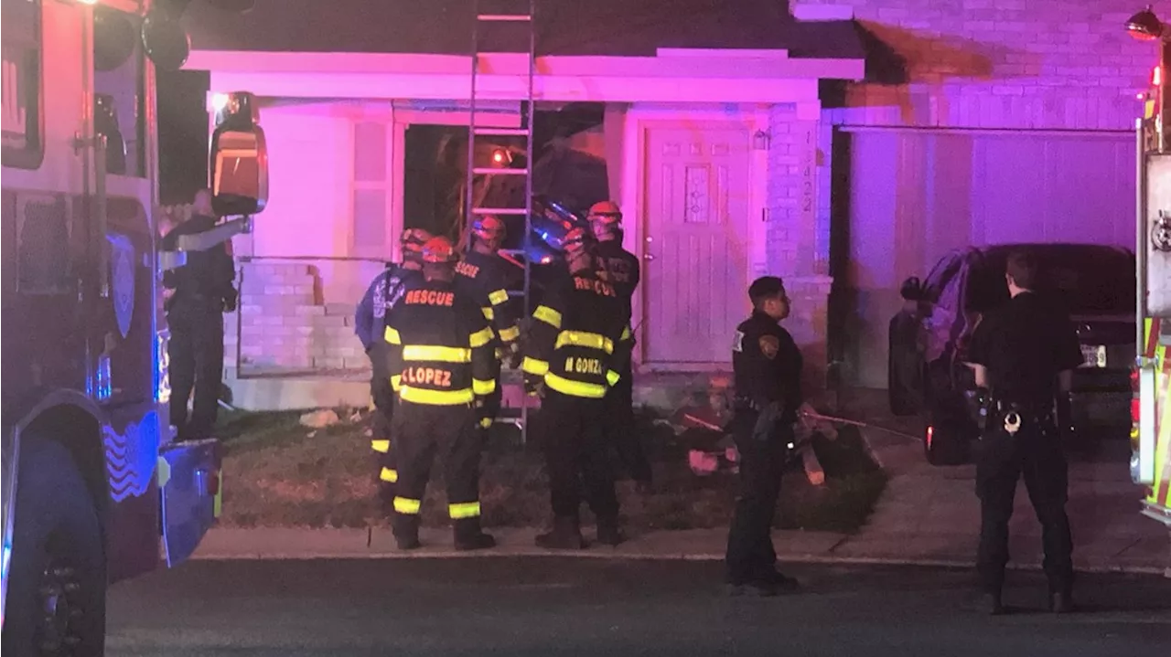 Family rescued after vehicle crashes through northwest-side home