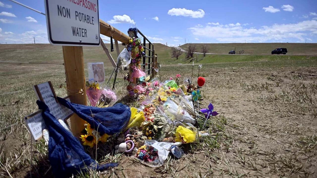 Colorado men accused of taking 'memento' photo after rock-throwing death appear in court