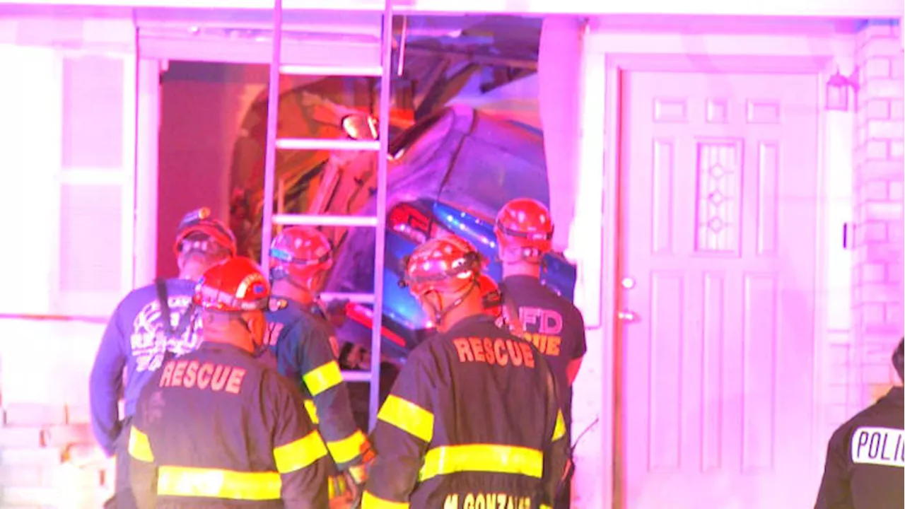 2 children, mother rescued by firefighters after car crashes into home, destroying staircase