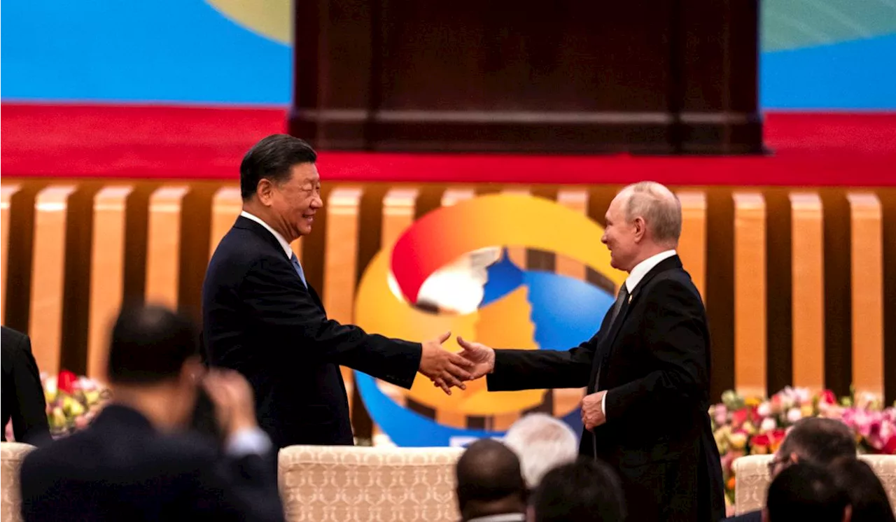 Russian President Putin and Chinese leader Xi meet in Beijing and call for close policy coordination