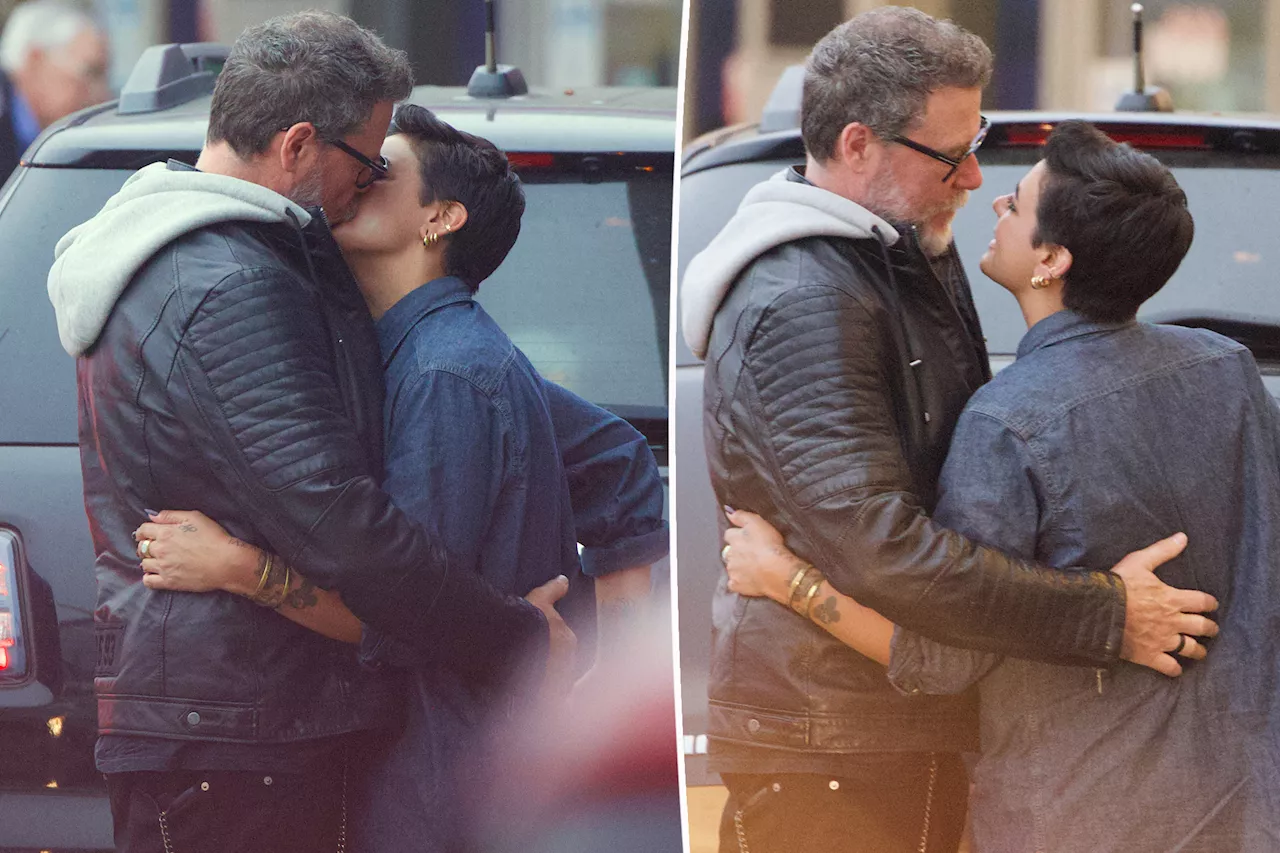 Dean McDermott and new girlfriend Lily Calo share passionate kiss at airport