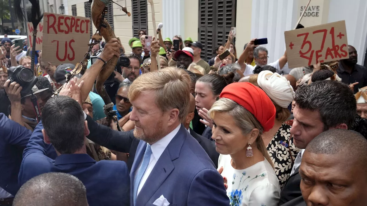 Dutch king and queen are confronted by angry protesters on visit to a slavery museum in South Africa