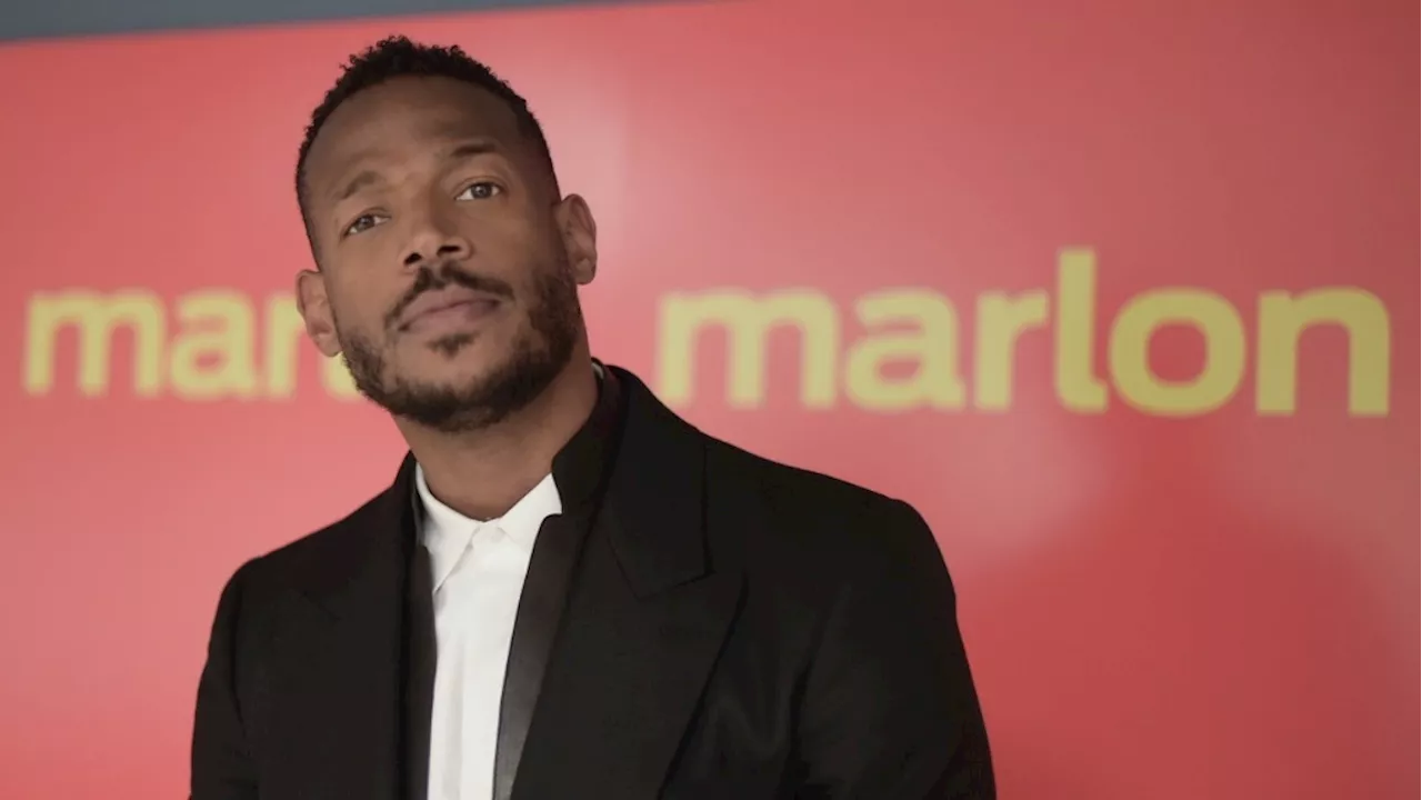 Marlon Wayans says he is being unfairly prosecuted after being racially targeted by gate agent