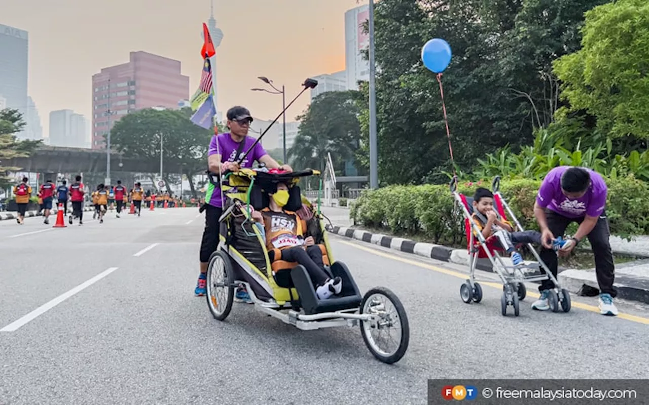 Lari 21km bersama, bapa dan anak Cerebral Palsy cetus inspirasi