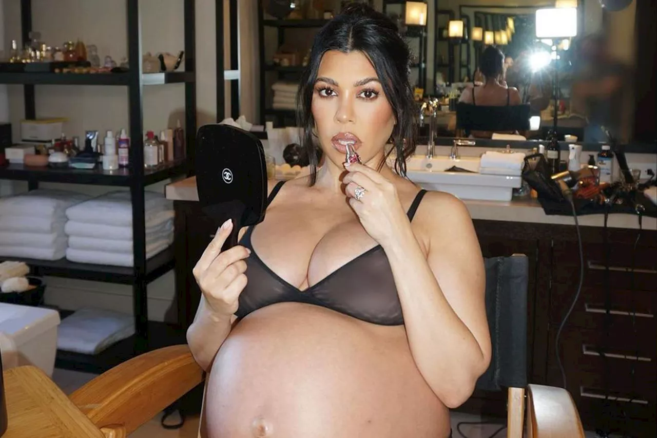 Pregnant Kourtney Kardashian Wears Sheer Bra and Applies Lip Gloss as She Bares Baby Bump