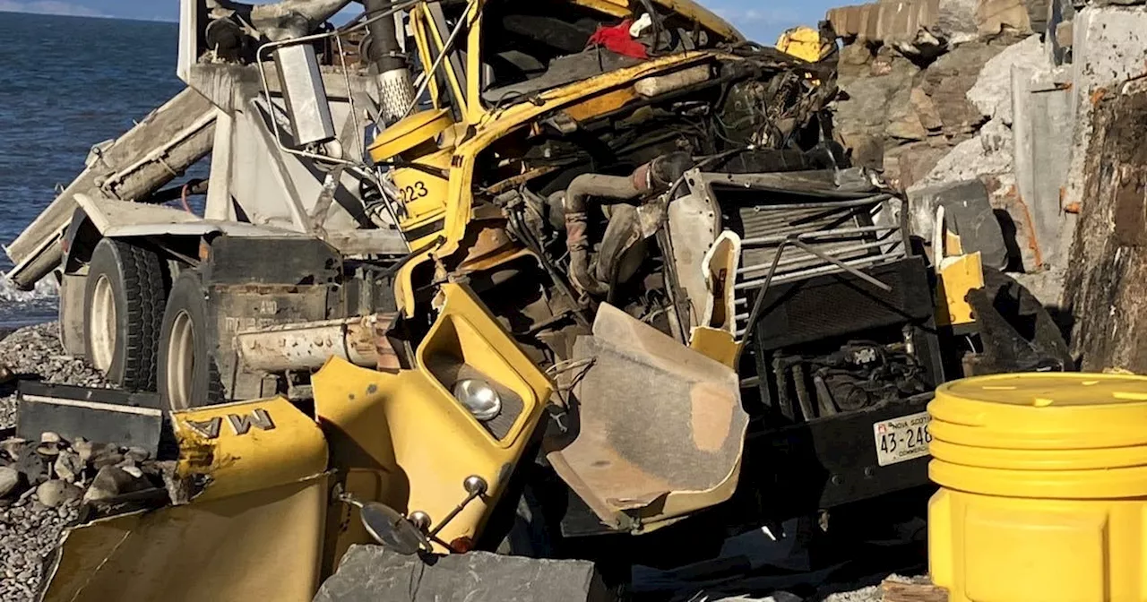 Cement truck driver suffers minor injuries when vehicle plunges over Kings County embankment onto beach