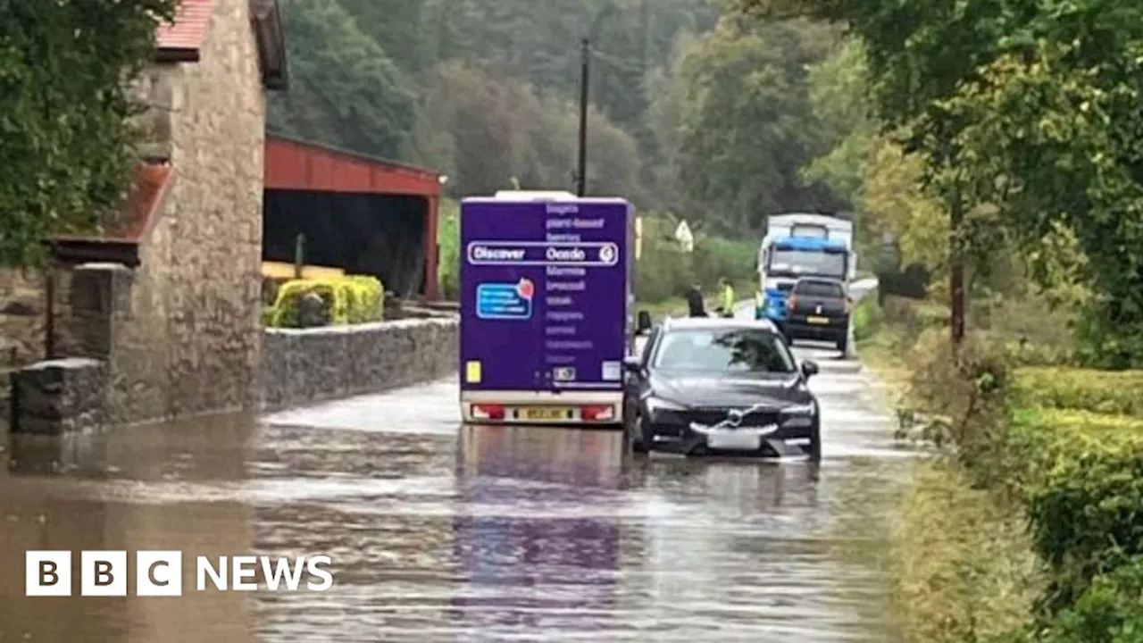 Storm Babet: People told to stay indoors as floods trap cars