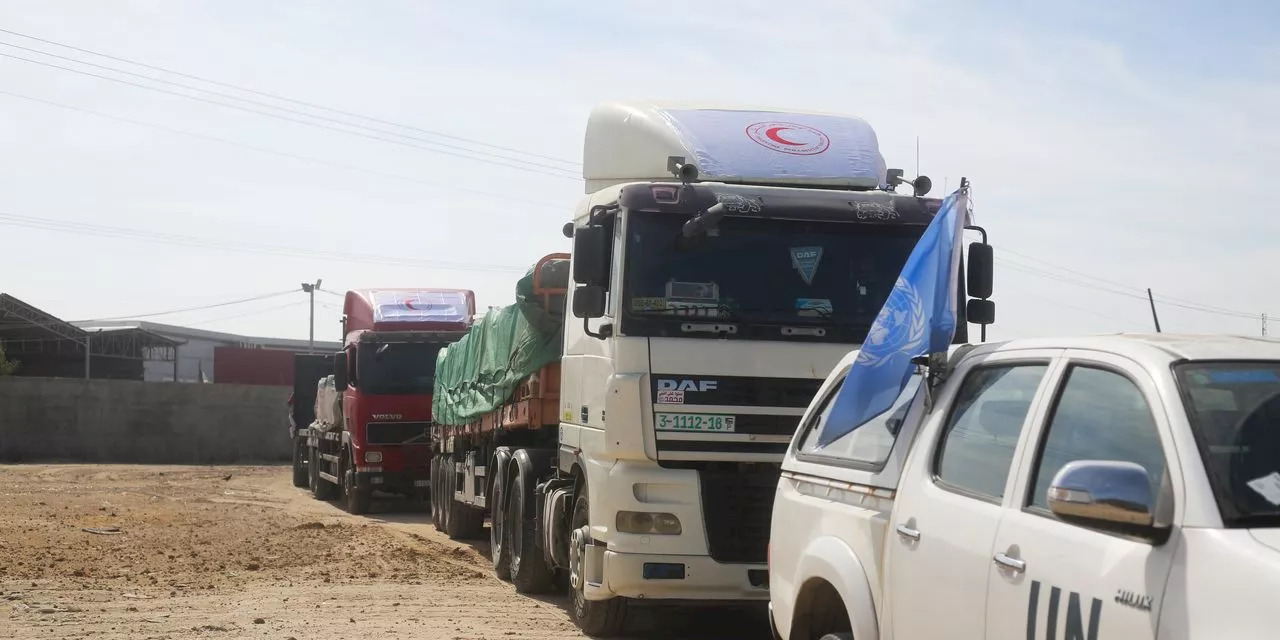 Egypt's border crossing opens to let a trickle of desperately needed aid into besieged Gaza