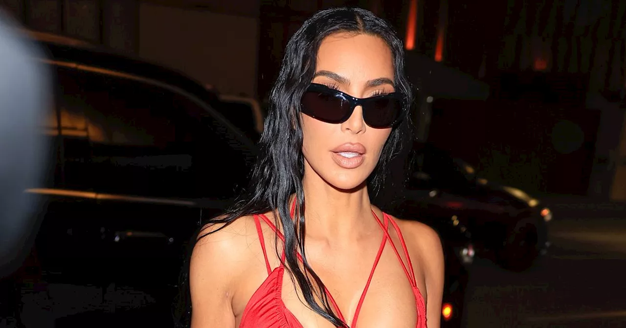 Kim Kardashian is a vision in red celebrating her birthday at star-studded party