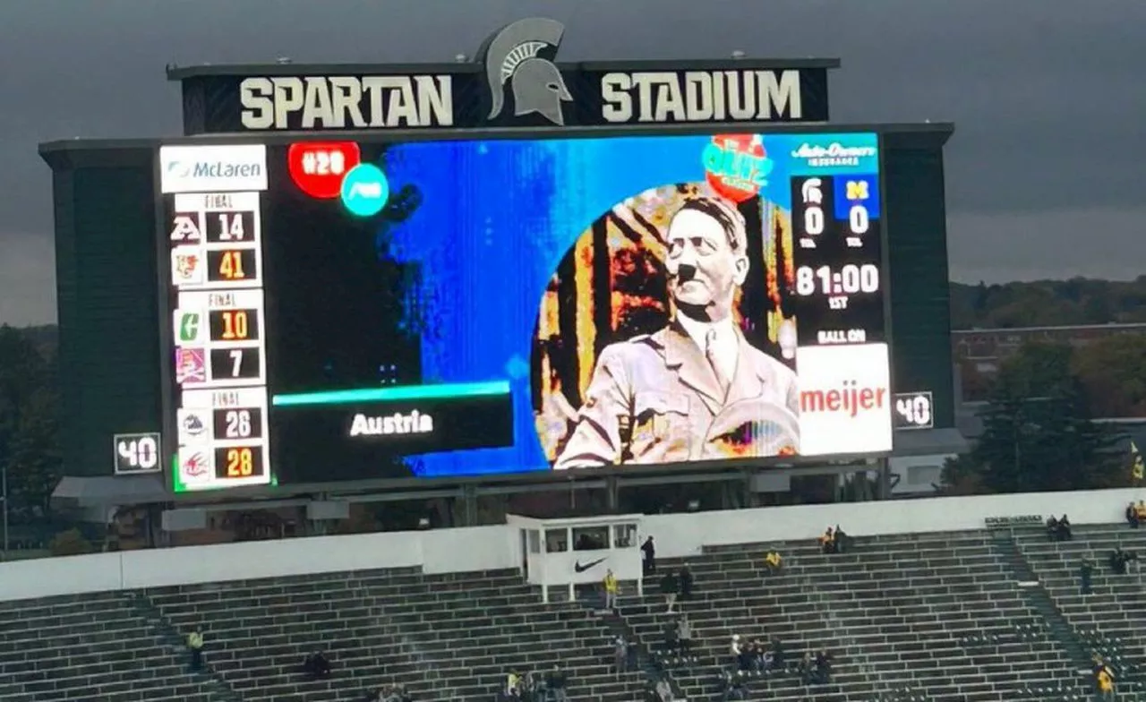 Michigan State broadcast picture of Hitler on scoreboard during Michigan game