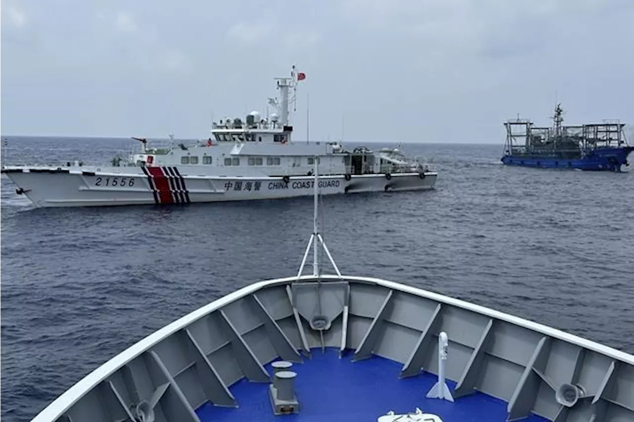 Philippines says a coast guard ship and supply boat are hit by Chinese vessels near disputed shoal