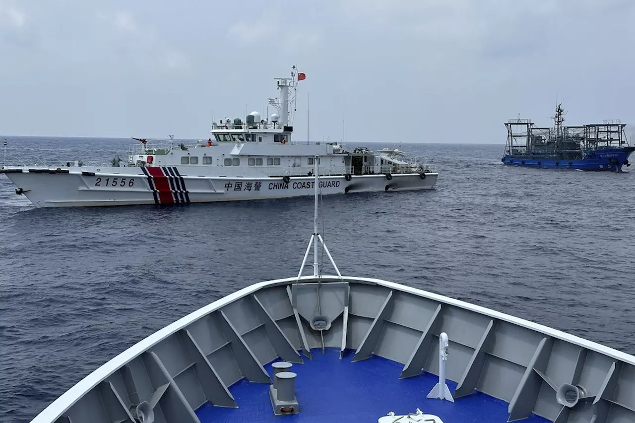 Philippines says a coast guard ship and supply boat were rammed by Chinese vessels at disputed shoal