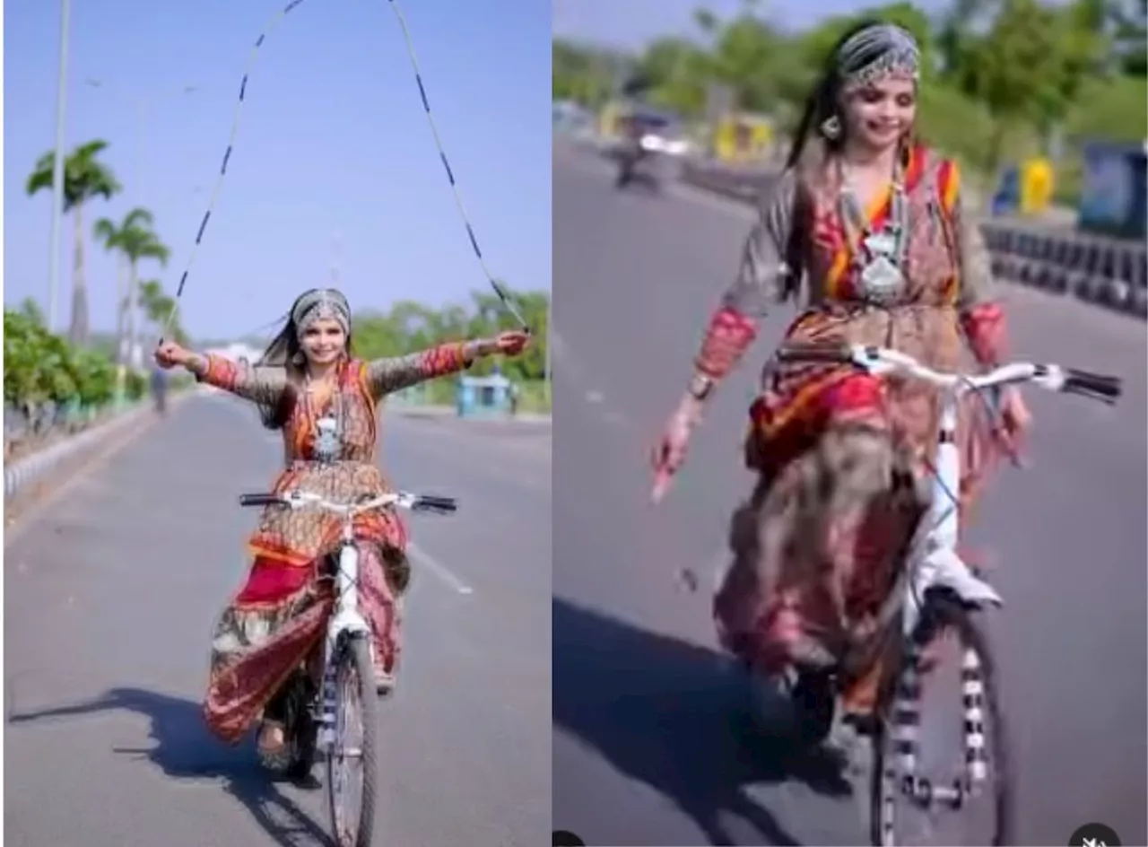 Watch: Woman performs bizarre stunt with jumping rope while riding bicycle (Video)