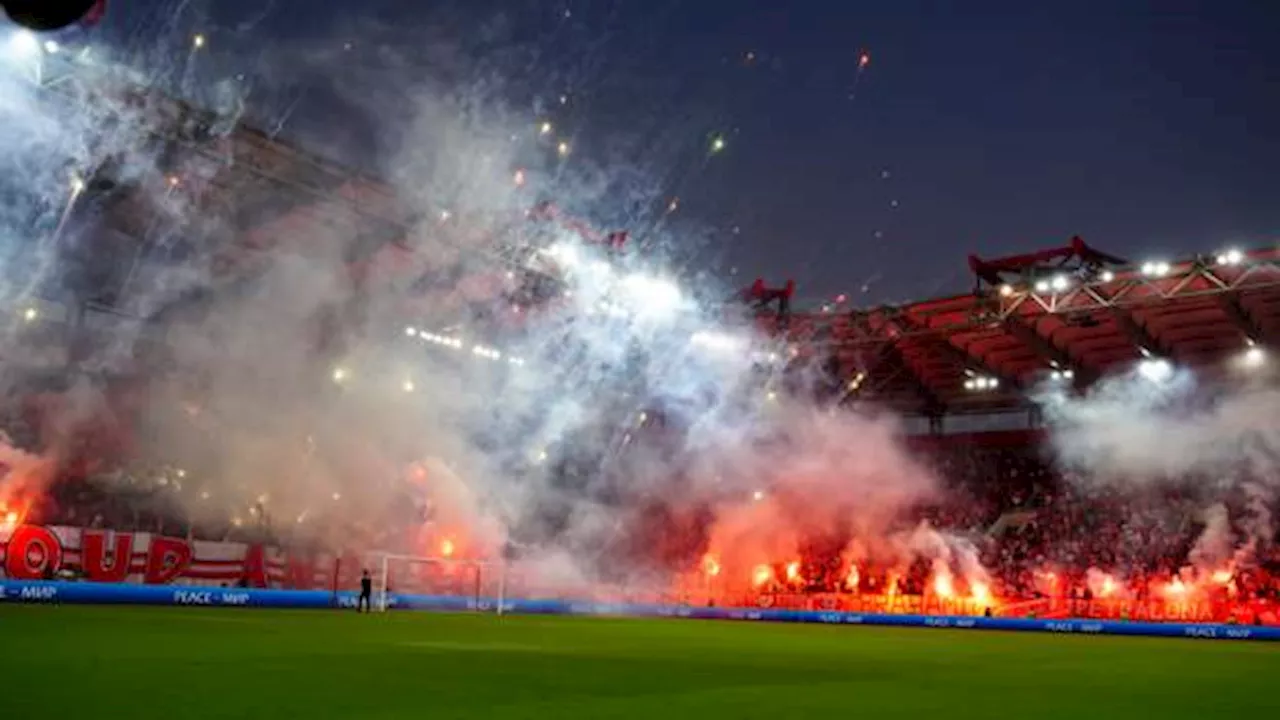 Olympiakos-Panathinaikos abandoned as player struck by firecracker