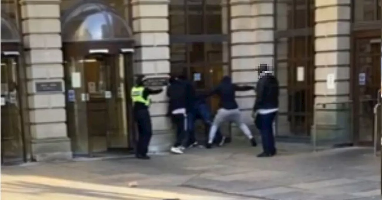 Violent 'rammy' erupts outside Edinburgh Sheriff Court as three brawl in street