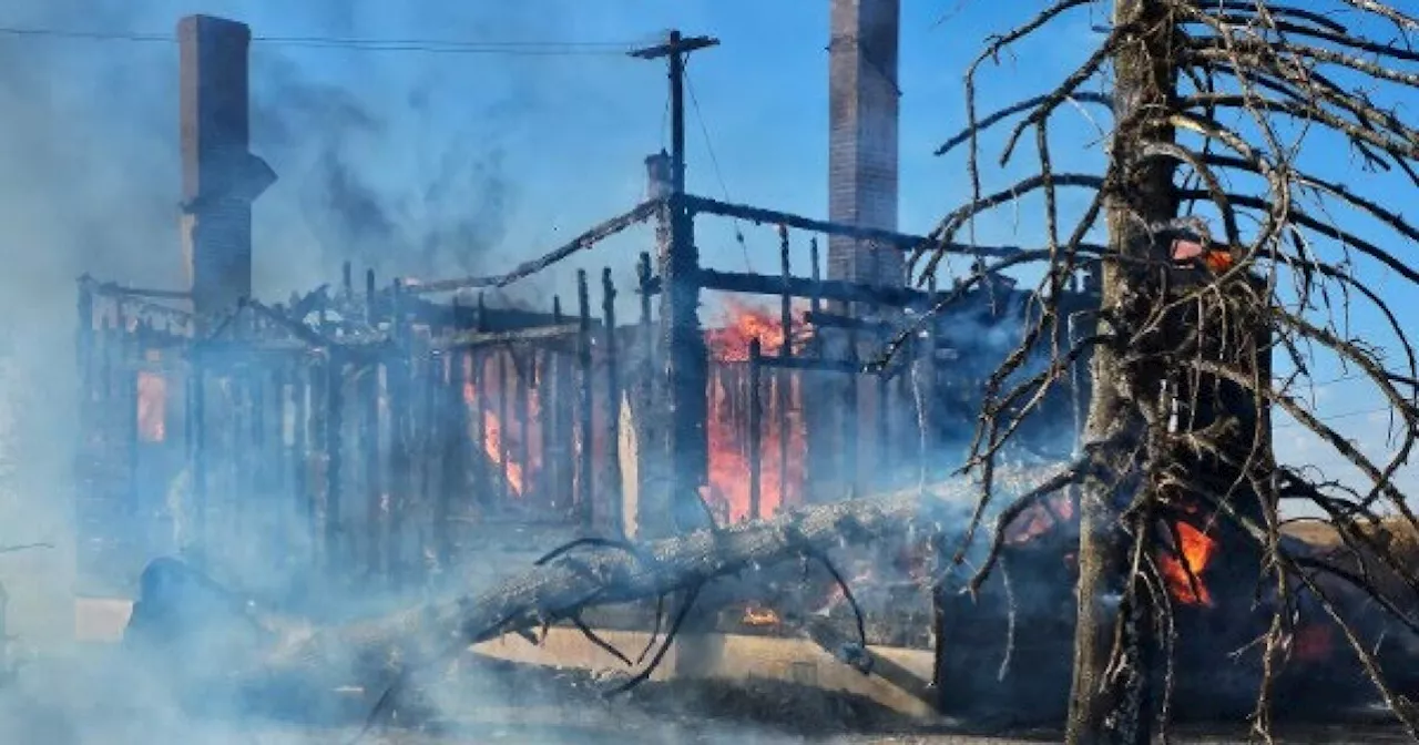 Investigation begins into origin of fire that burned abandoned house, grassland in Aurora on Sunday afternoon