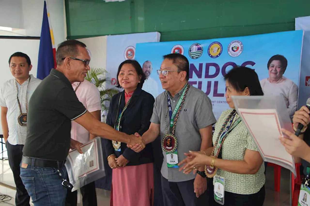 DENR awards land titles to 32 in Dapitan City