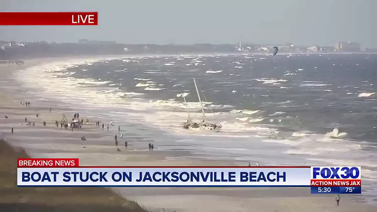 Sailboat washes ashore on Jacksonville Beach near Hampton Inn