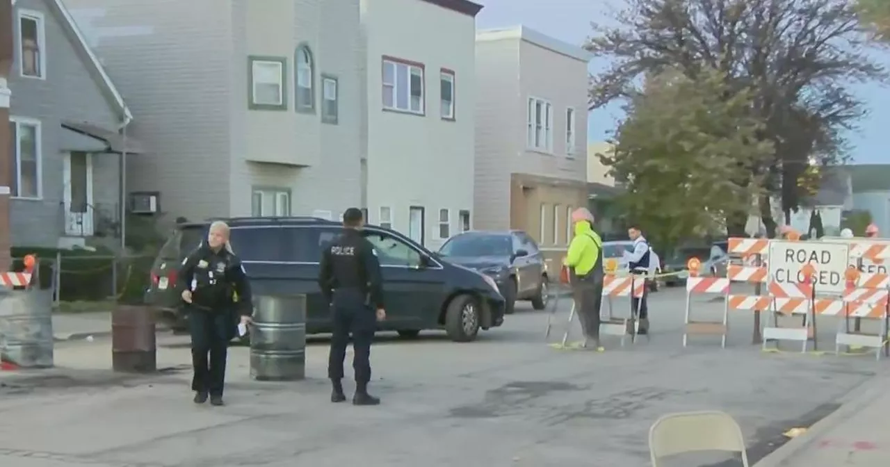 Neighbors block driveway of proposed migrant tent site during protest on Chicago's Southwest Side