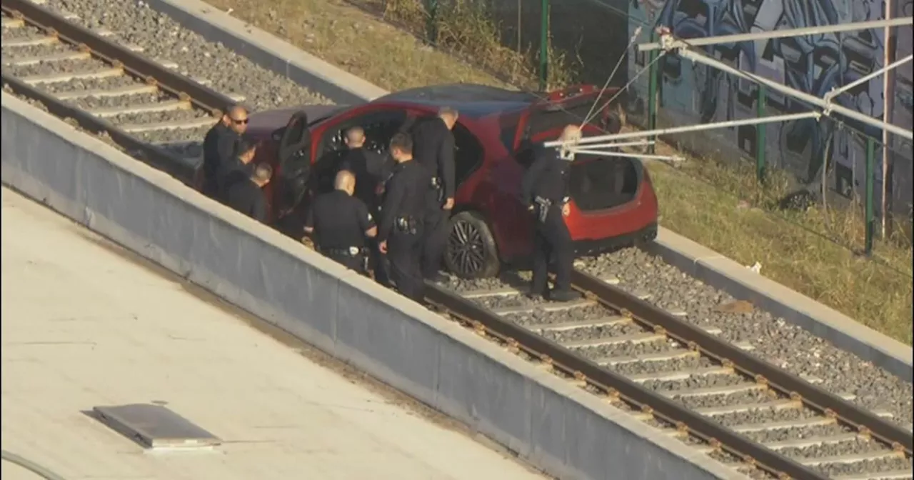 Los Angeles police chase burglary suspect ditches getaway vehicle on train tracks