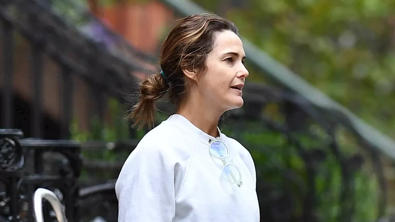 Keri Russell is BAREFOOT as she steps outside her Brooklyn brownstone to talk to a man during her...