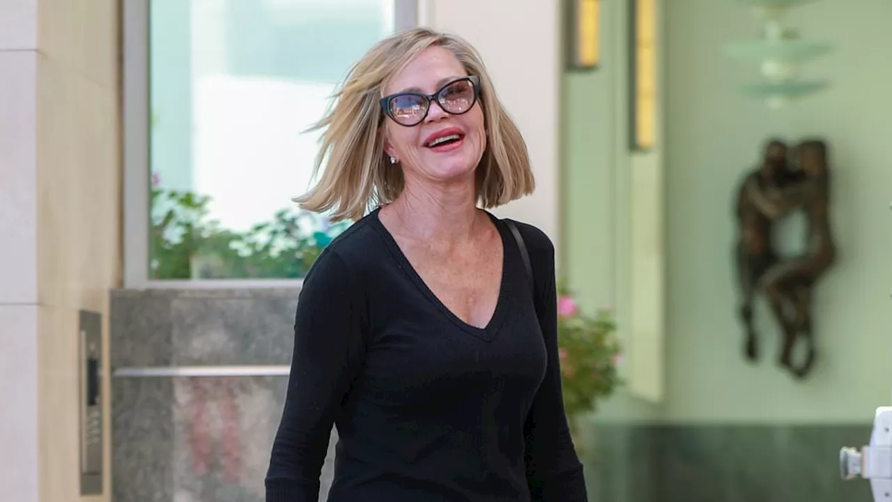 Melanie Griffith looks oh-so chic as she shows off her sleek bob and trim figure during spot of...