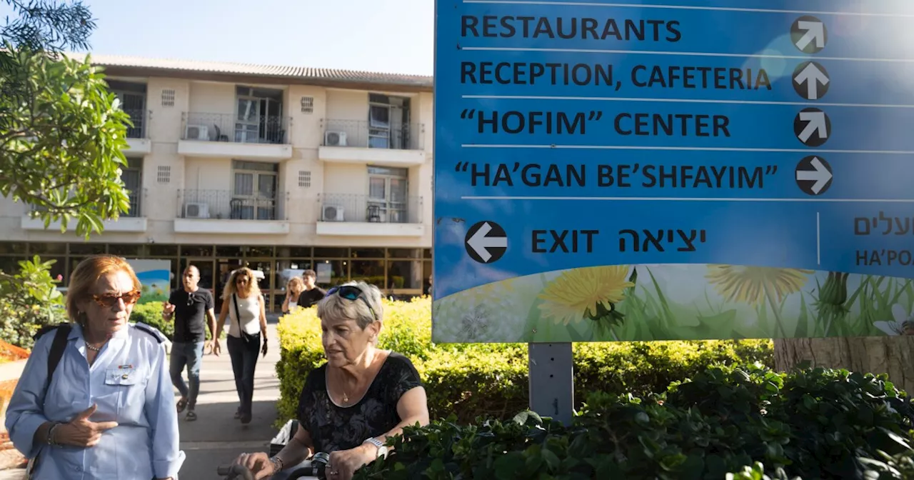 Their kibbutz hit hard by Hamas, Israeli survivors take refuge mourning inside a hotel