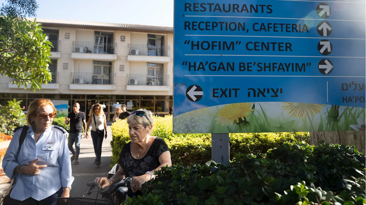 Their kibbutz hit hard by Hamas, Israeli survivors take refuge mourning inside a hotel