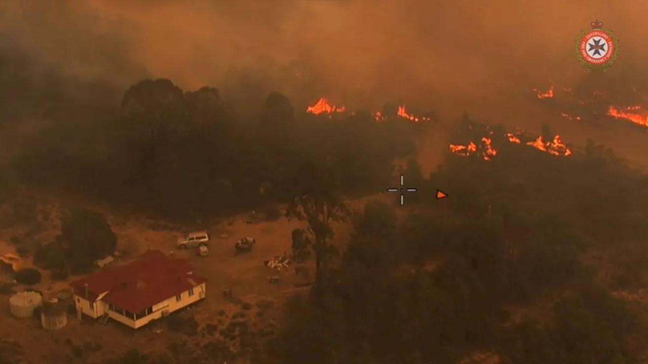 Woman suffers fatal heart attack during attempt to evacuate home in Tara as bushfires ravage Queensland