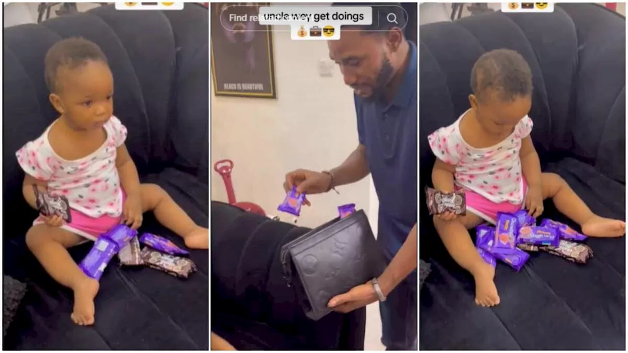 Nigerian Man 'Makes It Rain' Biscuits on Surprised Neice, Says “Uncle Is Here, Eat My Money”