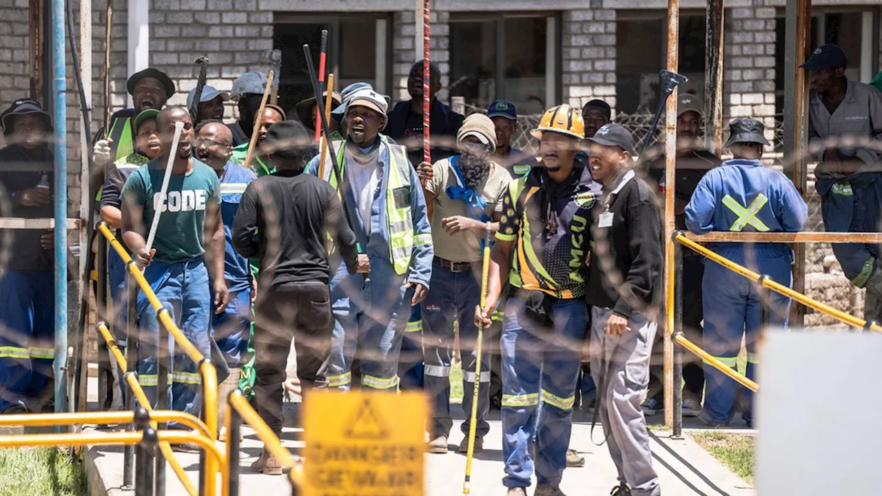 Hundreds of workers leave South African gold mine after three days being held 'hostage' underground