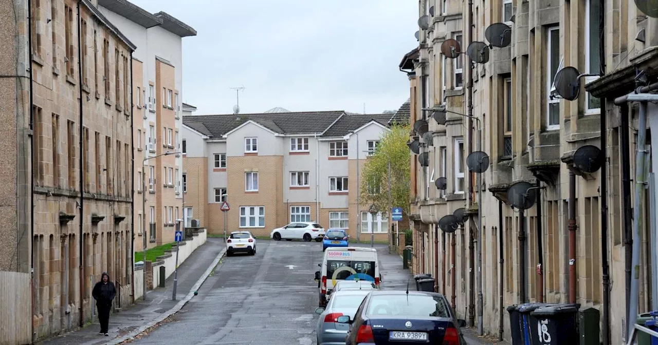 Armed police race to Paisley street after reports of a woman being attacked