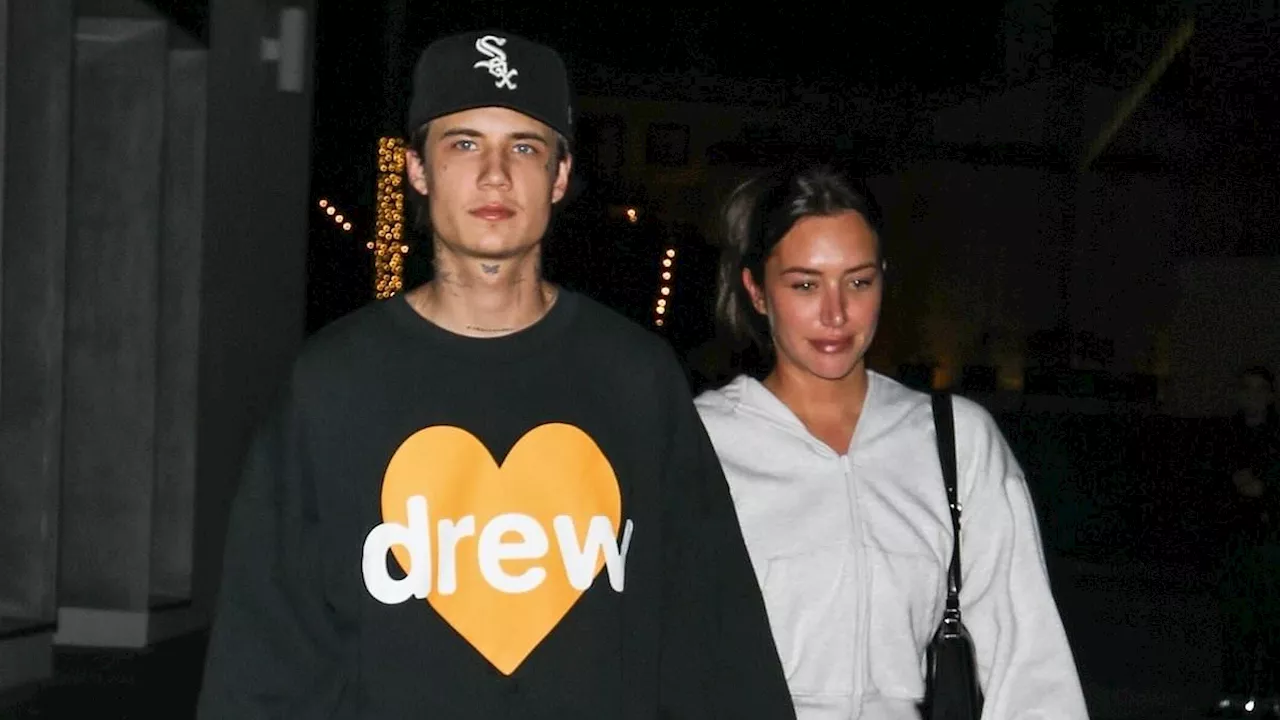 Kylie Jenner's pal Stassie Karanikolaou and beau Jaden Hossler hold hands after enjoying a double...