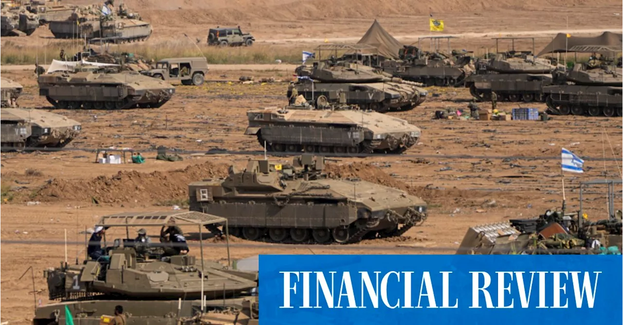 Israel-Hamas conflict: Israeli troops briefly raid Gaza to prepare for full invasion