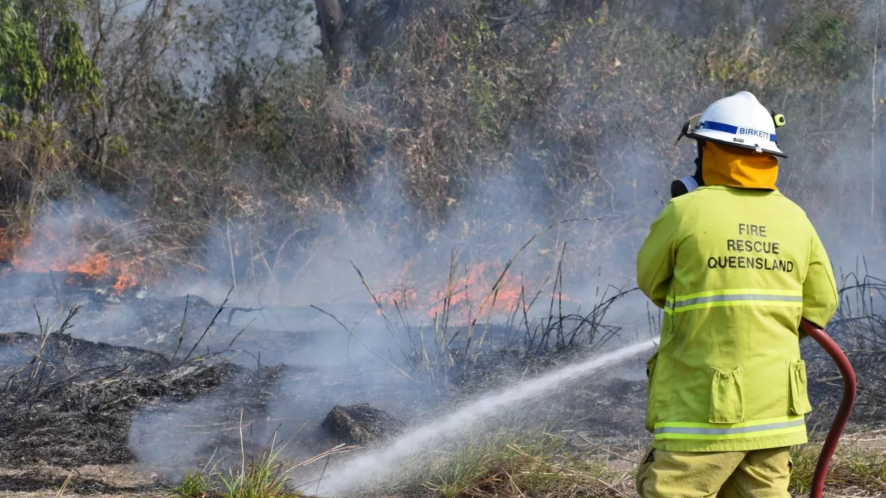 Urgent evacuations and warnings as blistering fires tear through Queensland