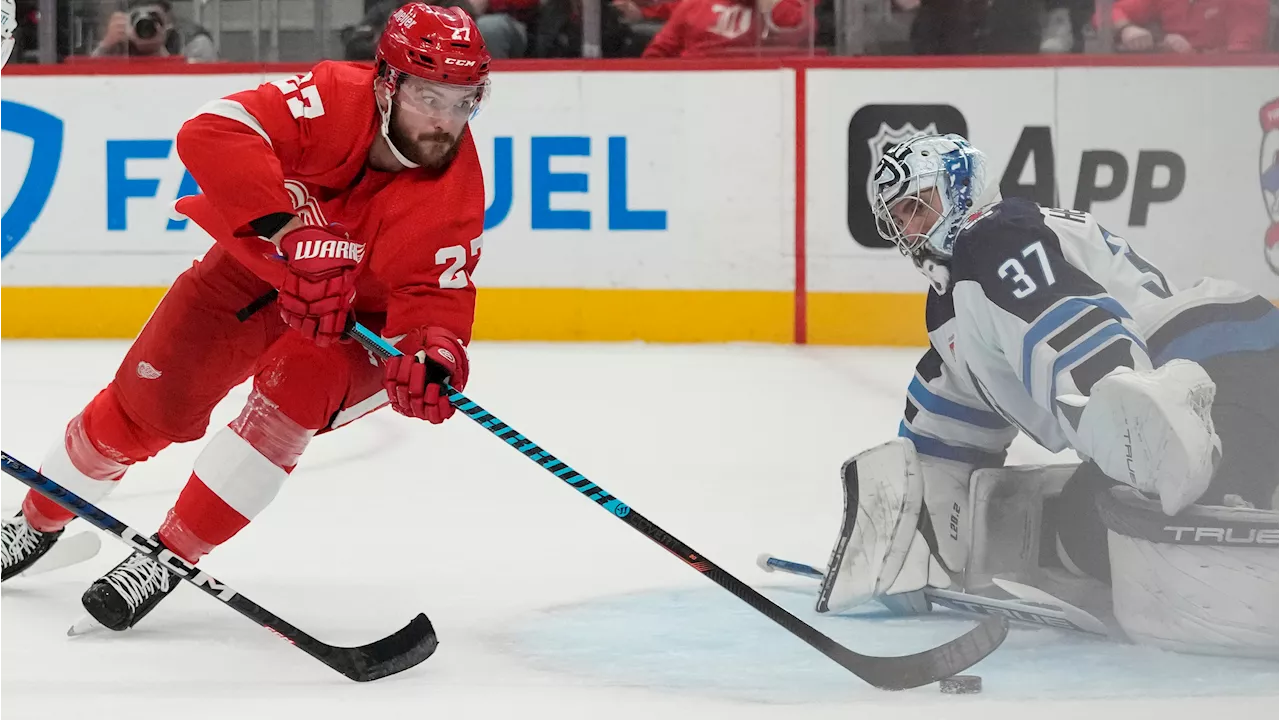 Hellebuyck makes 35 saves, leading Jets to win over Red Wings