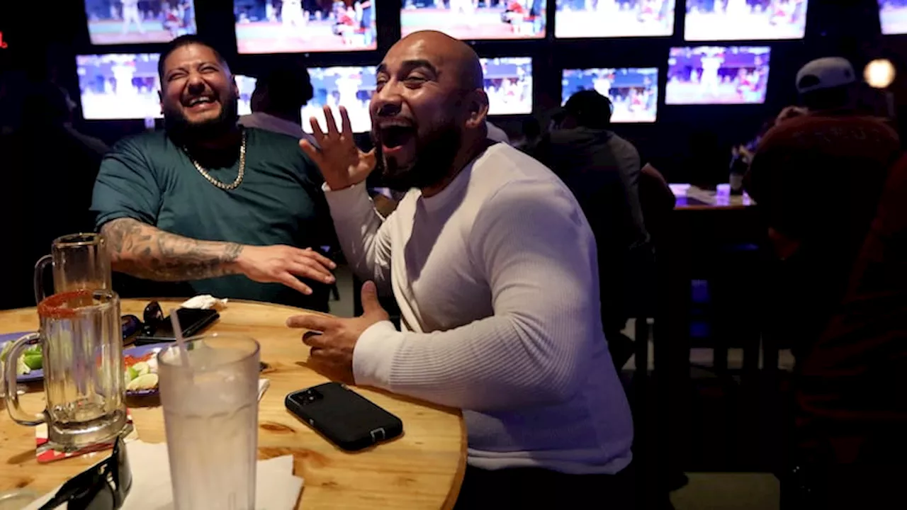 Latino fans pack Dallas sports bar to cheer Rangers in World Series opener