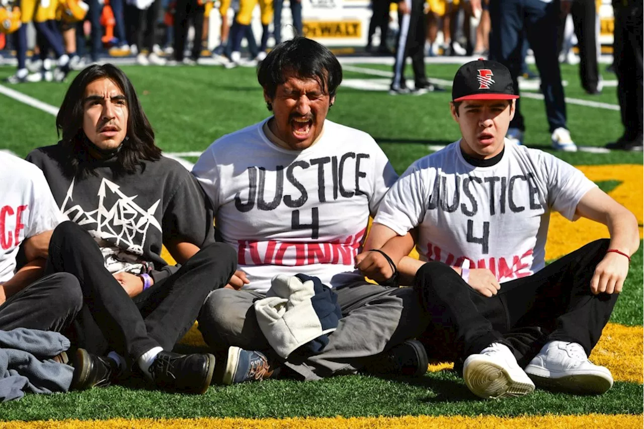 Protesters delay USC football game in fitting end to Cal rivalry
