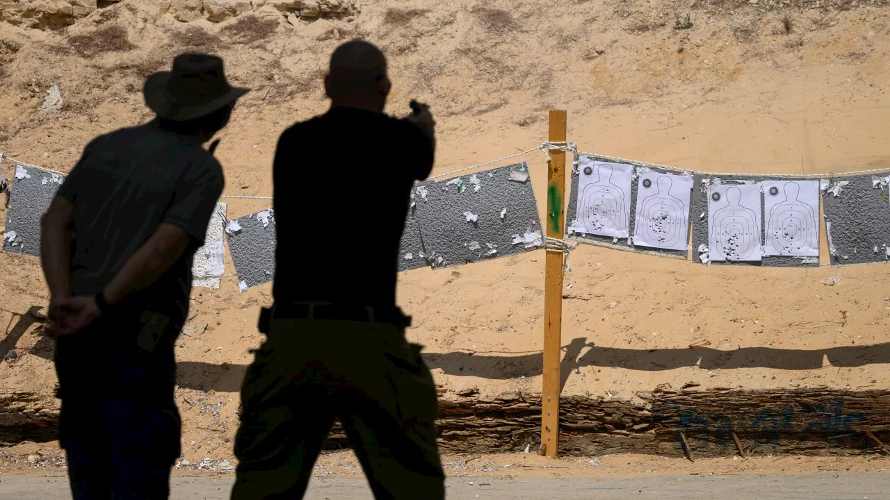 Israelis rush to arm themselves with guns to protect family as war rages on