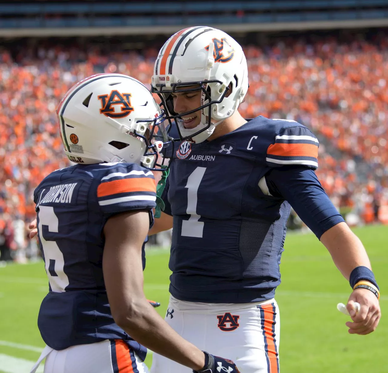 Watch young Auburn fan rip off shirt, lose mind celebrating, then reality hits