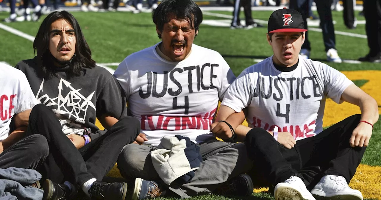 USC Cal State game delayed due to protesters demonstrating on field